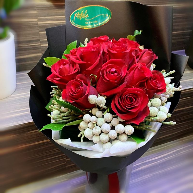 Passionate Red Roses with elegant black wrapping